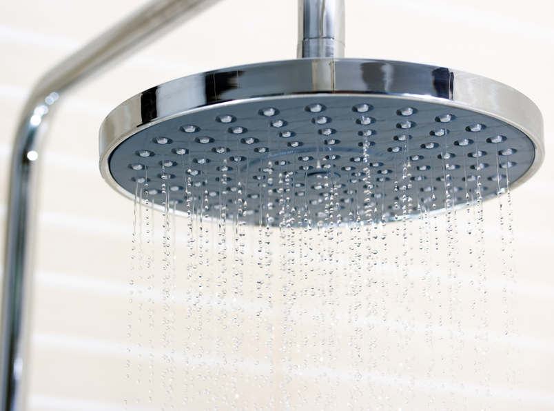 Closeup of shower head turned on