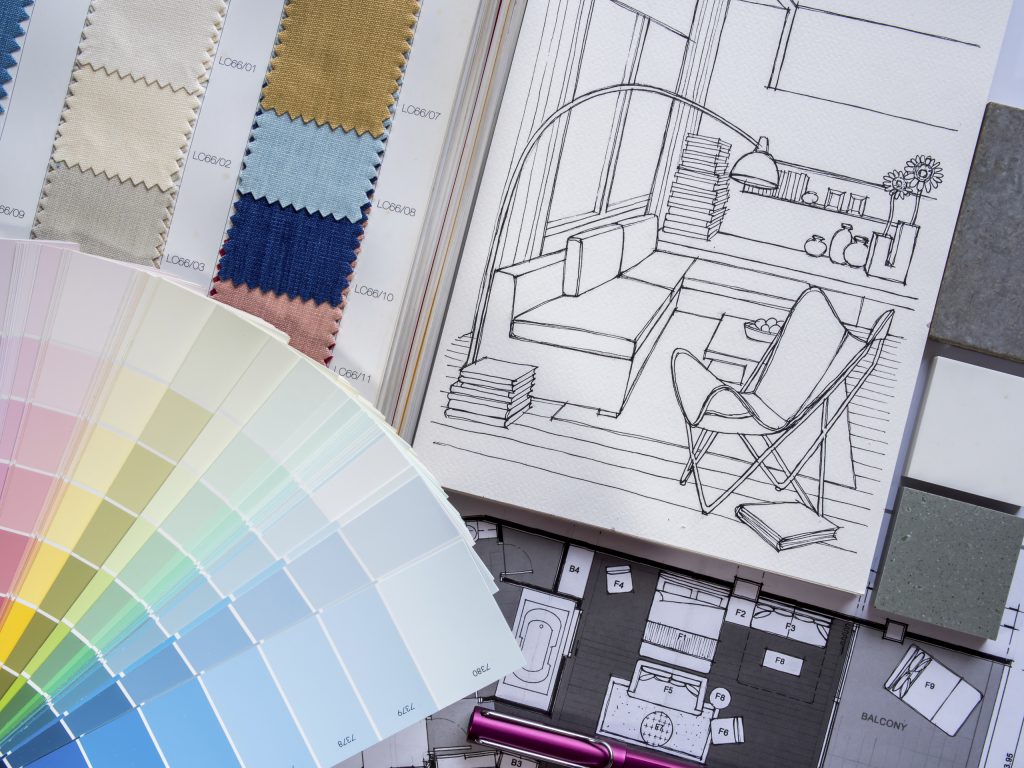 Paint and fabric samples with living room drawings