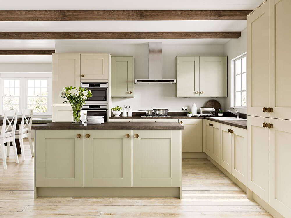 A kitchen with cream cabinets and a wood floor
