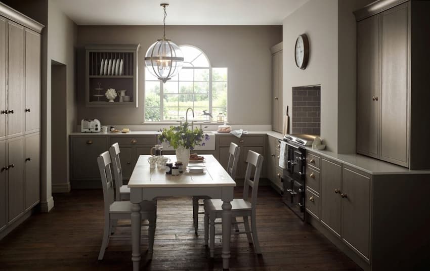 A kitchen with a table and chairs