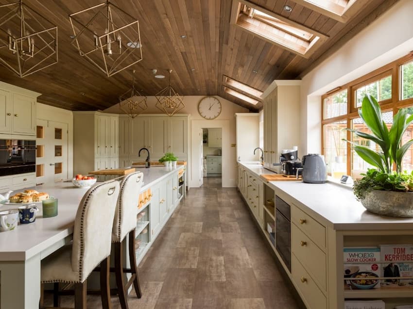 A kitchen with a table and chairs