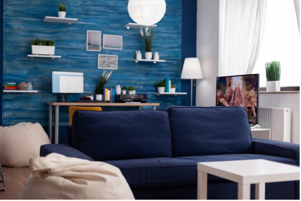 A person sitting on a couch in a living room