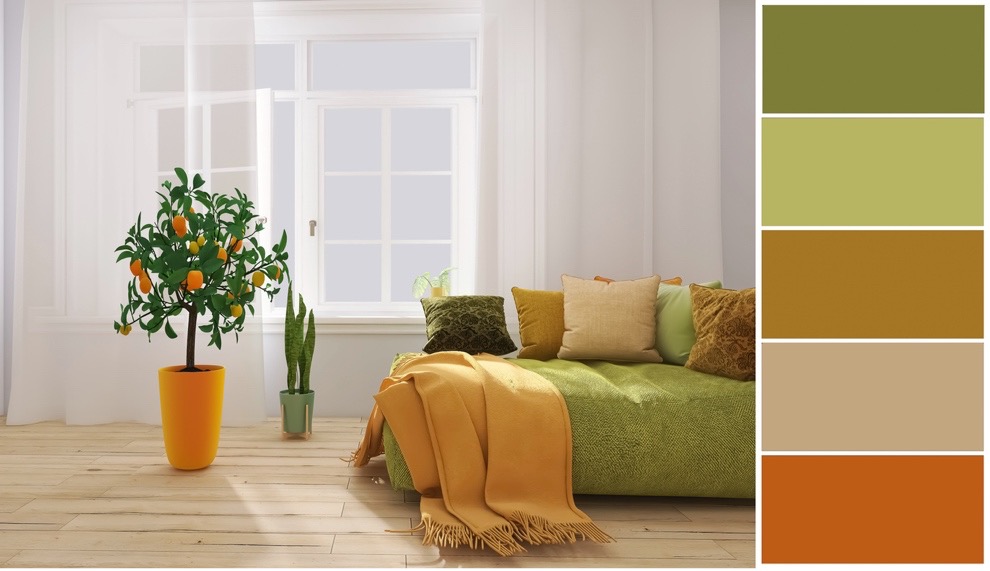 A room with a couch and a plant